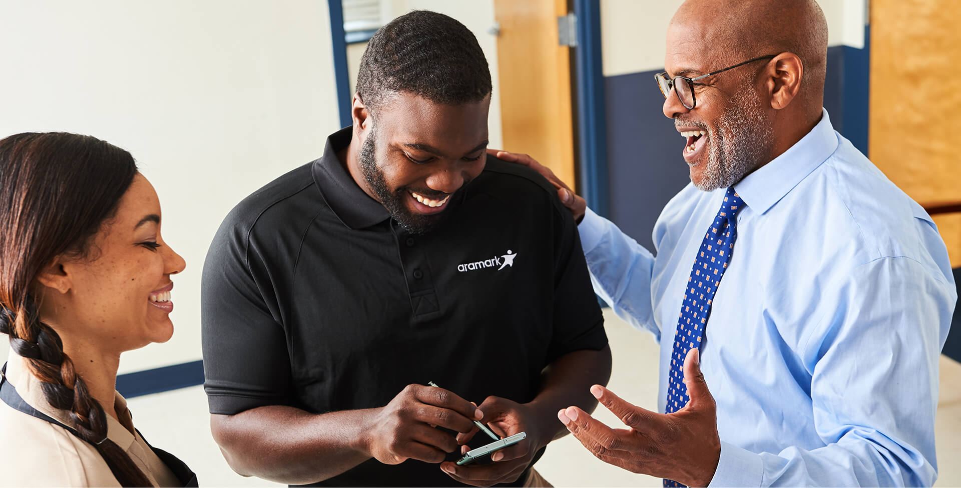 Aramark employees talking in a healthcare setting.